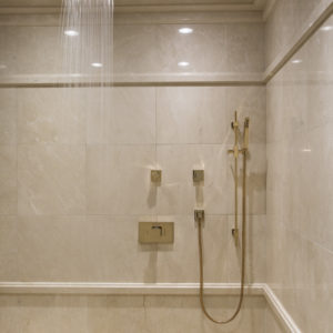 Shower head and bathroom fixtures on display at the Immerse Showroom
