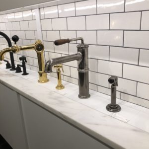 bathroom faucets on display at the immerse showroom in st. louis