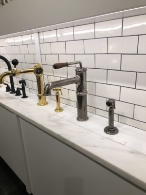 bathroom faucets on display at the immerse showroom in st. louis
