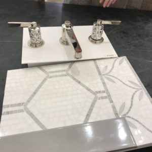 bathroom faucet and tile on display at the immerse showroom in st. louis