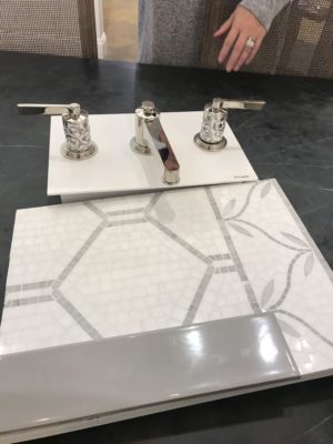 bathroom faucet and tile on display at the immerse showroom in st. louis