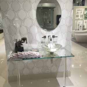 luxury tile, mirror, alape sink, and faucet on display at the immerse bathroom furniture showroom