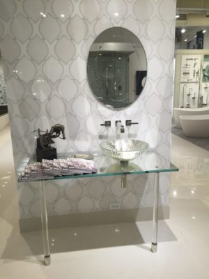 luxury tile, mirror, alape sink, and faucet on display at the immerse bathroom furniture showroom