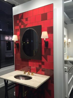 beautiful bathroom tile, mirror, sink and faucet on display at the immerse showroom in st. louis