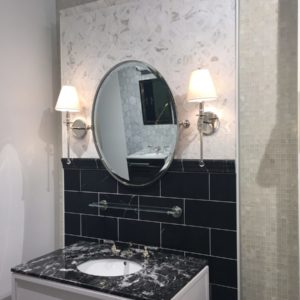 luxury bathroom mirror, vanity, sink and faucet on display at the immerse showroom in st. louis