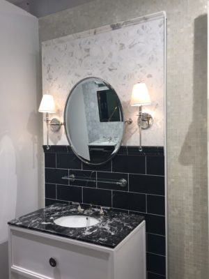 luxury bathroom mirror, vanity, sink and faucet on display at the immerse showroom in st. louis