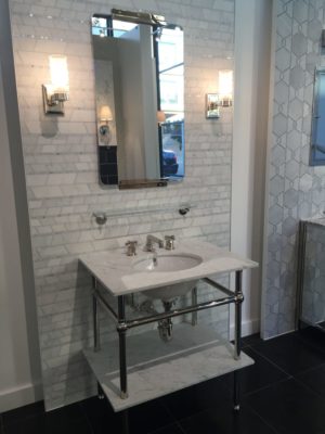 bathroom mirror, vanity, sink, and faucet on display at the immerse bath furniture gallery