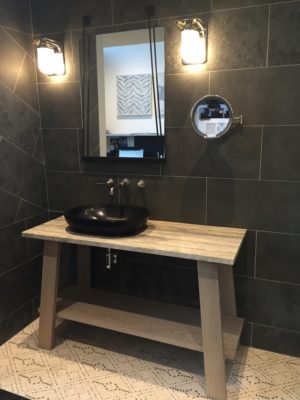 luxury mirror, alape sink and faucet on display at the immerse showroom in st. louis