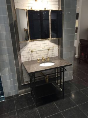 luxury interior of bathroom with tile, vanity, and sink on display at immerse