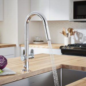 delta faucet on display at the immerse fixtures showroom in st. louis