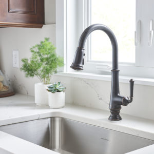 luxury kitchen faucet and sink on display at the immerse showroom in st. louis