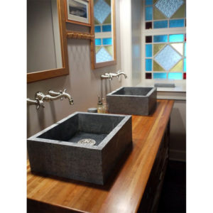 bathroom faucet and stoneforest sinks on display at the immerse showroom in st. louis