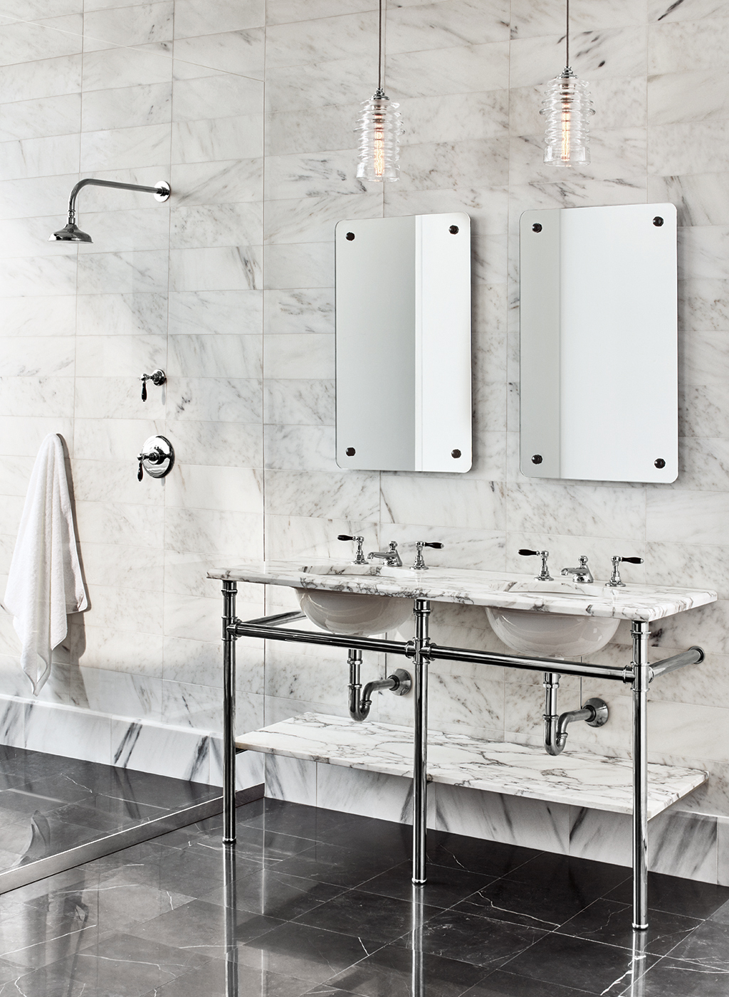 designed bathroom with waterworks faucets, sinks, mirrors, and accessories