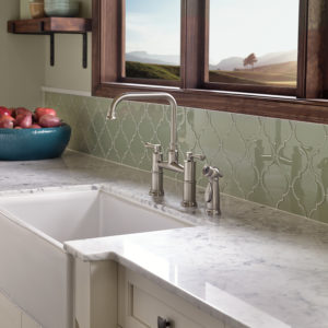 farmhouse kitchen sink and faucet on display at the immerse showroom in st. louis