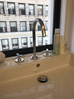 bathroom and kitchen sink and faucet on display at the immerse showroom in st. louis