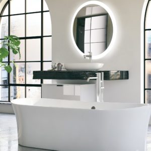 lighted vanity mirror and bathtub on display at the immerse showroom