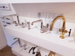 bathroom faucets on display at the immerse gallery showroom in st. louis