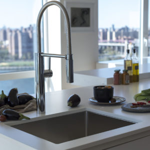luxury pull down faucet in designer kitchen on display at immerse