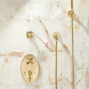 gold bathroom shower fixtures on display at the immerse showroom in st. louis