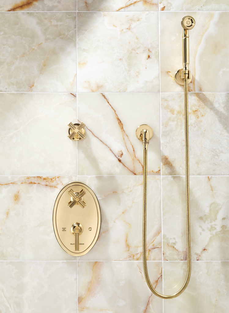 gold bathroom shower fixtures on display at the immerse showroom in st. louis