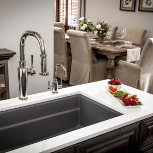 functional kitchen faucet and sink on display in designed space