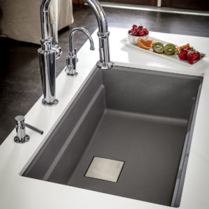 functional kitchen faucet and sink on display in designed space