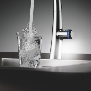 luxury kohler faucet filling up glass of water