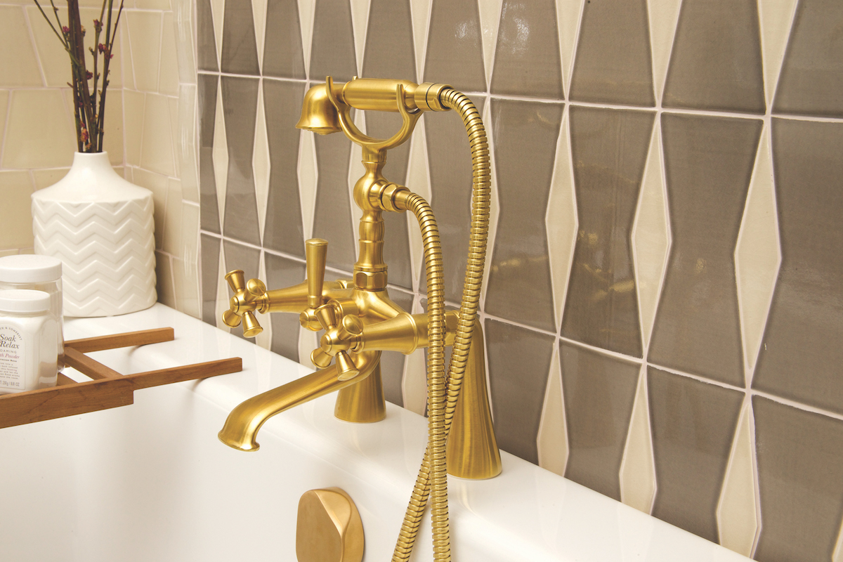 beautiful luxury gold faucet at the immerse fixtures gallery showroom in st. louis