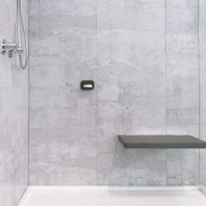 walk-in shower with cube seat accessories at the immerse bathroom and accessories showroom in st. louis