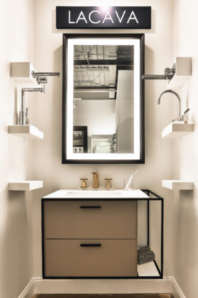 lacava lighted mirror, sink faucets, and vanity at the immerse showroom