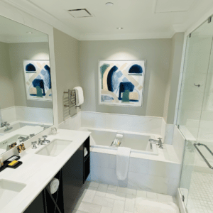 designer bathroom with bath tub and vanities on display at the Immerse Showroom
